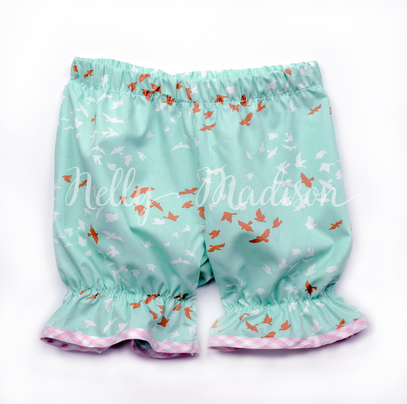vintage style little girl bloomer shorts in an aqua print and light pink gingham trim